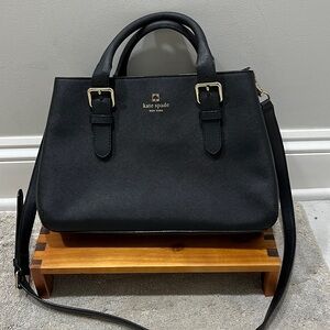 kate spade black leather handbag with crossbody strap. Casual and clean look.